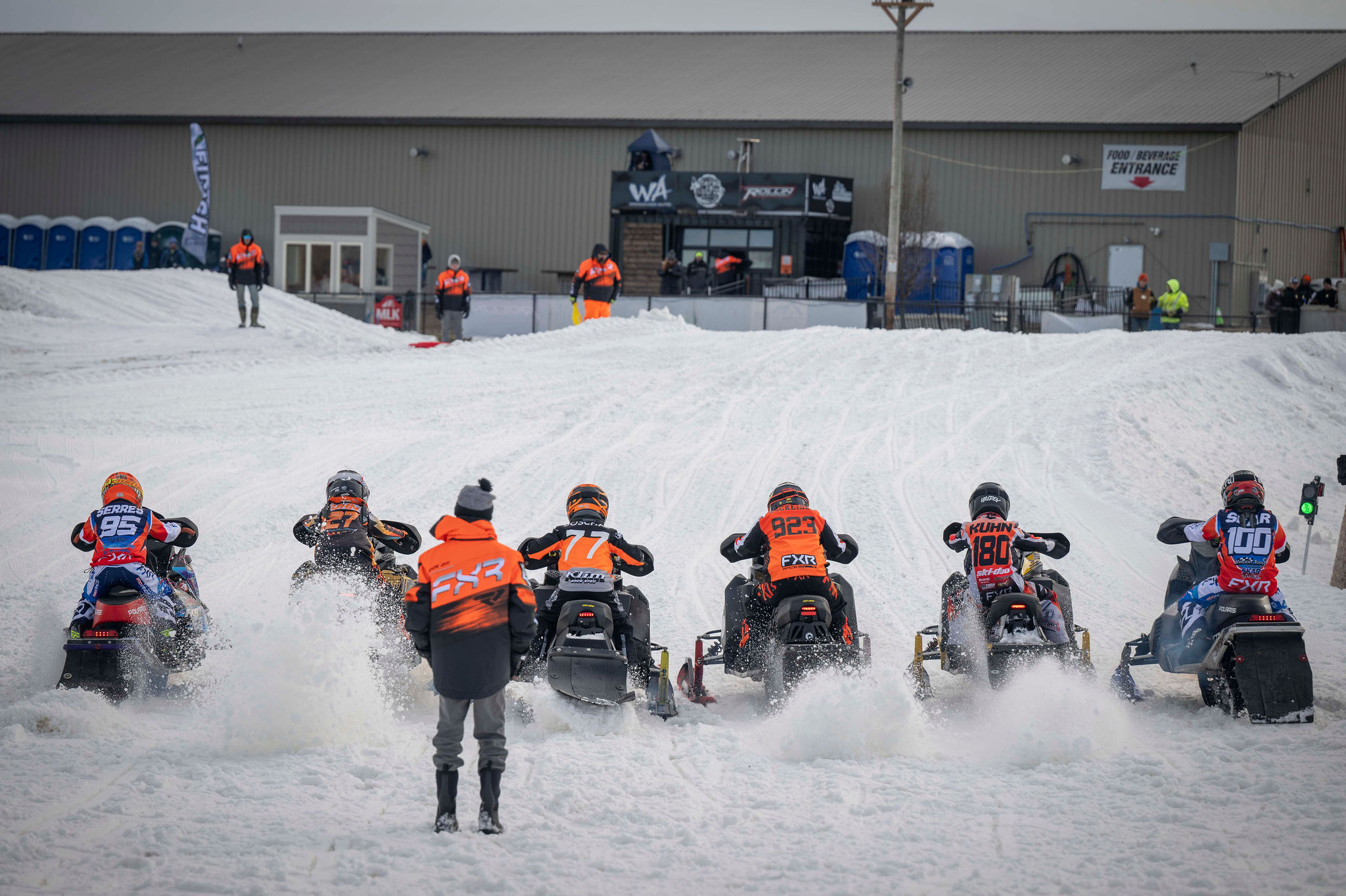 Snocross riders on the starting line at Hartford