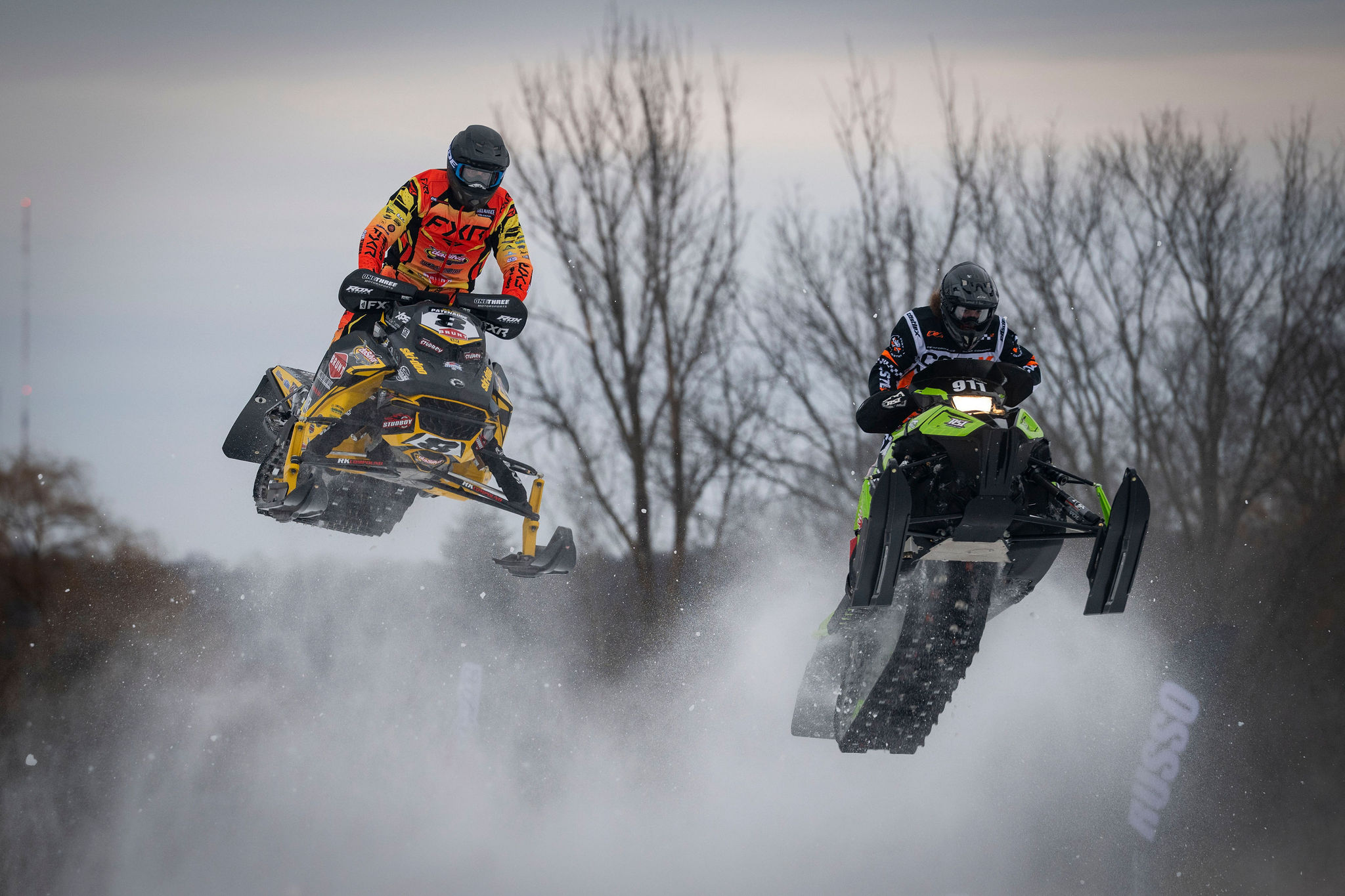 Two riders bar-to-bar over a Hartford jump